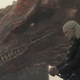 Caraxes the red dragon's huge head looms behind Daemon Targaryen.